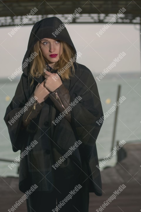 Fashion pose on pier in a cold day