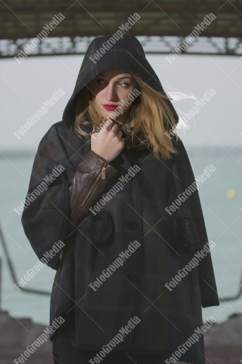 Fashion pose on pier in a cold day