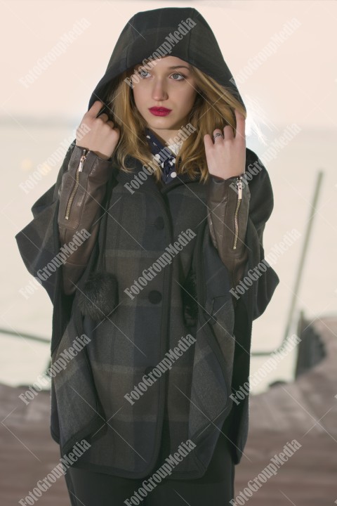 Fashion pose on pier in a cold day