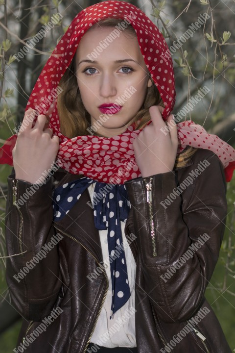 Close up portrait of a woman with red scarf