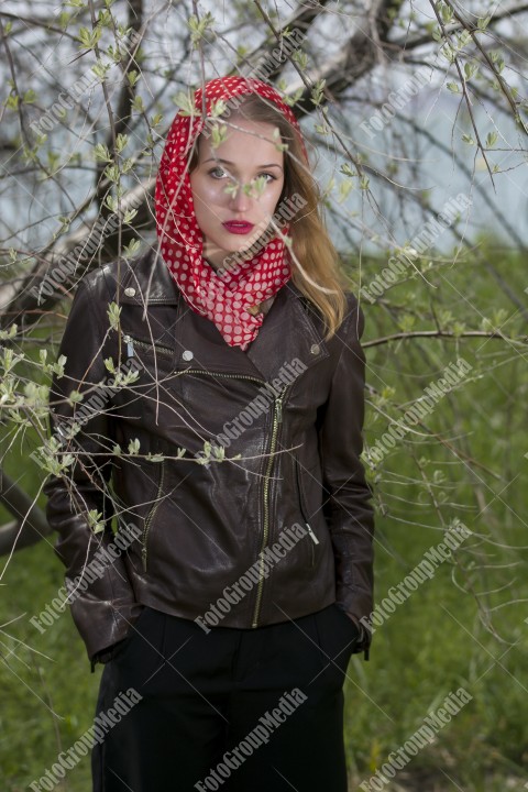 Portrait of a young girl with red scarf with white dots