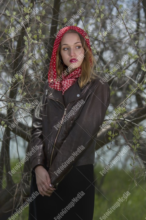 Blue eyes woman with red scarf posing for camera