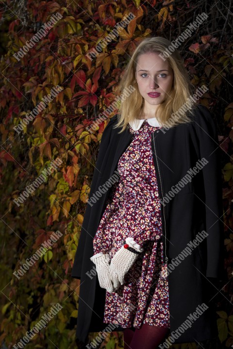 Outdoor portrait using colorful leafs as background