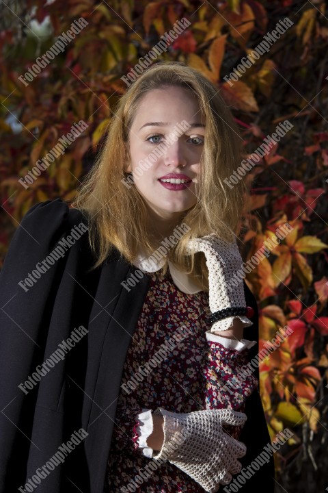 Outdoor portrait using colorful leafs as background