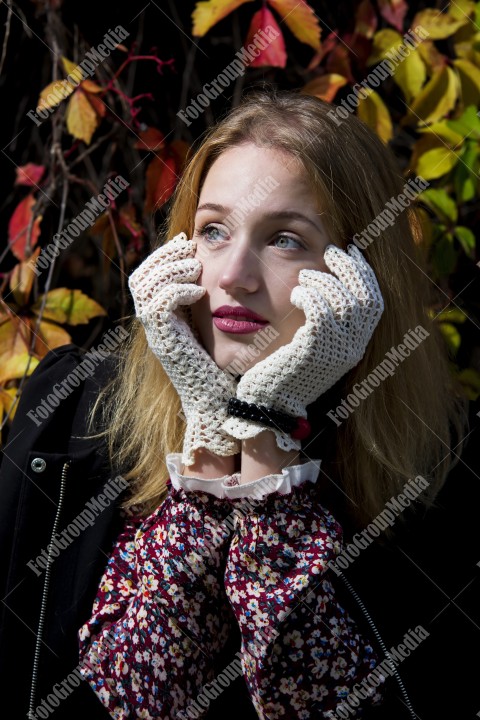 Outdoor portrait on colorful leafs background