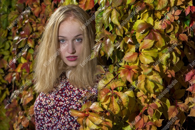 Outdoor portrait using colorful leafs as background