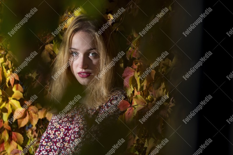 Outdoor portrait using colorful leafs as background