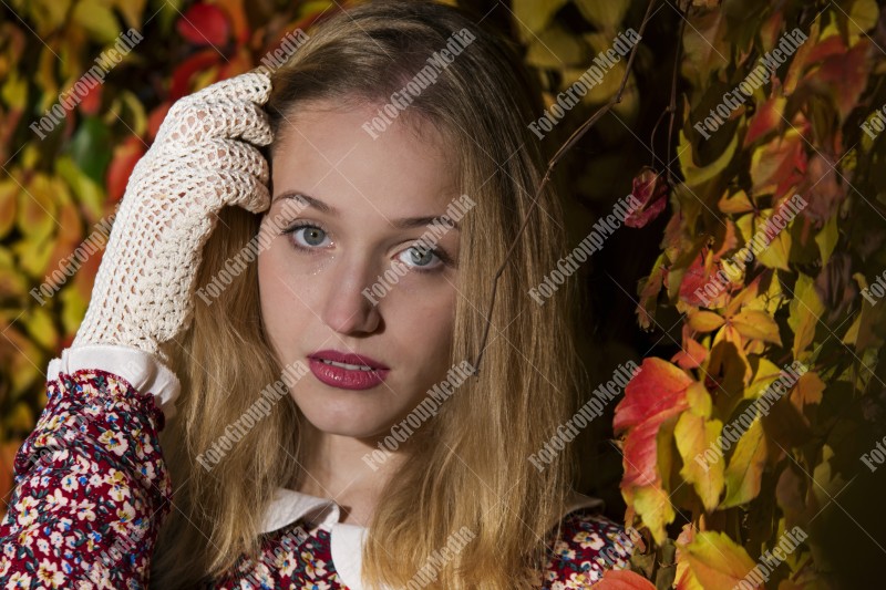 Outdoor portrait using colorful leafs as background