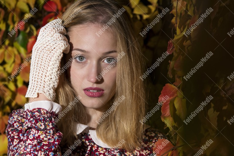 Outdoor portrait using colorful leafs as background