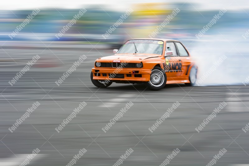 Sport car wheel drifting and smoking on track.