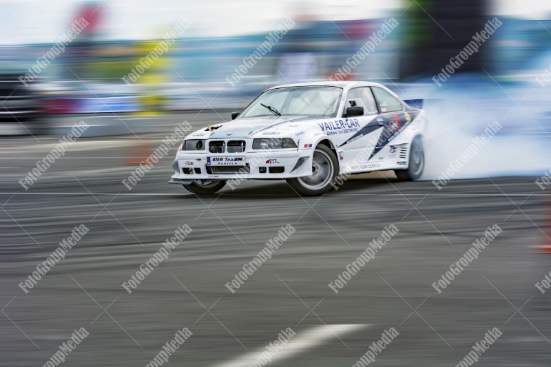 Sport car wheel drifting and smoking on track.