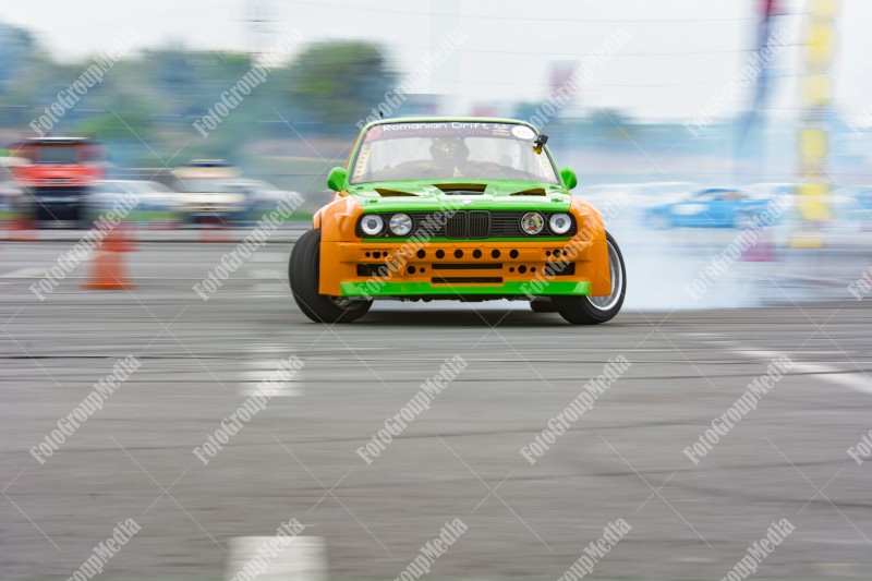 Sport car wheel drifting and smoking on track.