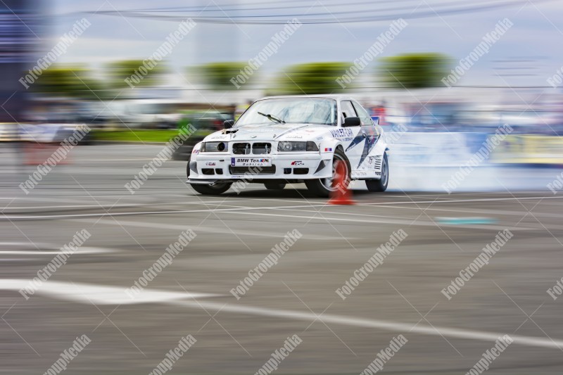 Sport car wheel drifting and smoking on track.