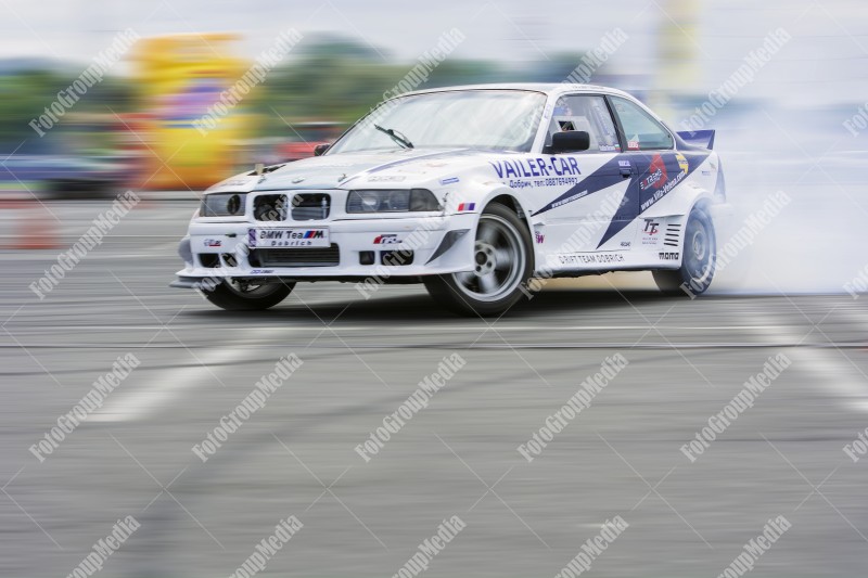 Sport car wheel drifting and smoking on track.