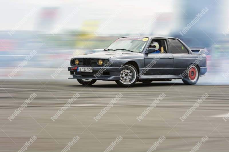 Sport car wheel drifting and smoking on track.