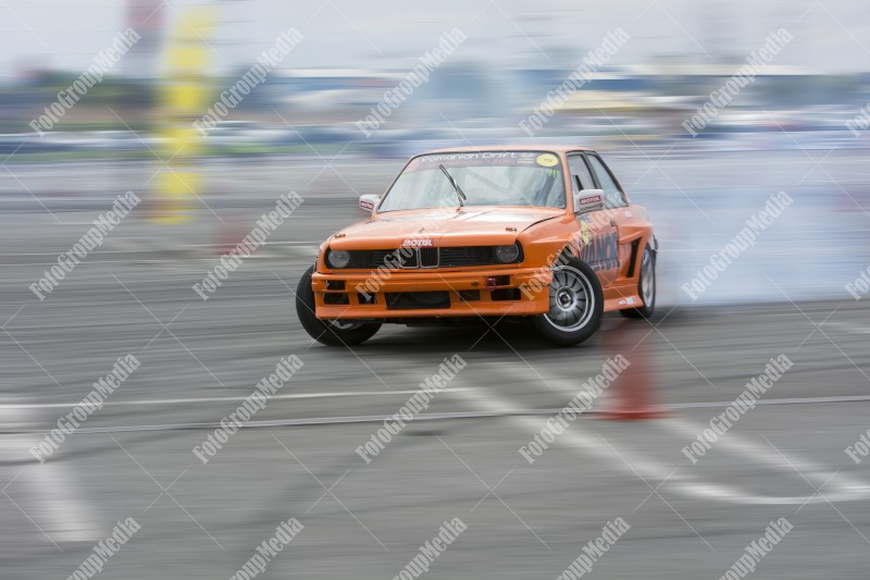 Sport car wheel drifting and smoking on track.