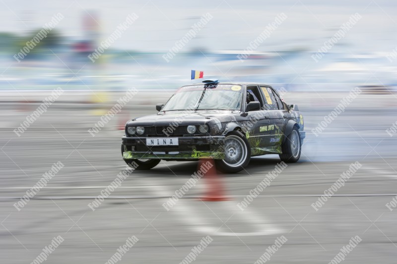 Sport car wheel drifting and smoking on track.