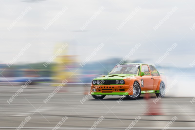 Sport car wheel drifting and smoking on track.