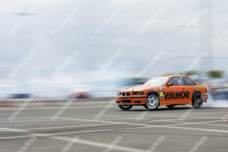 Sport car wheel drifting and smoking on track.