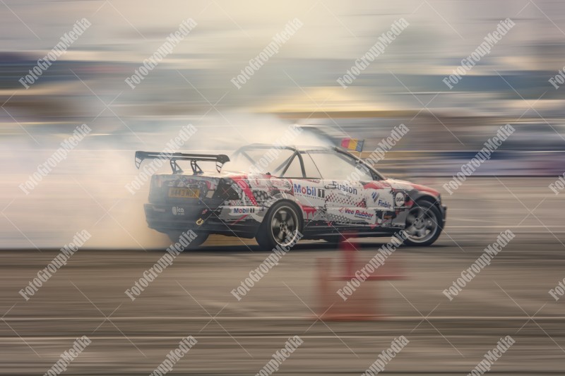 Sport car wheel drifting and smoking on track.