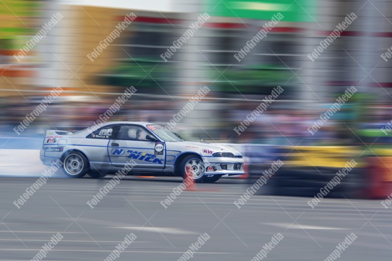 Sport car wheel drifting and smoking on track.