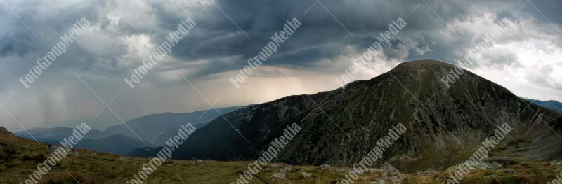 Panoramic view over Carpathian Mountains , Romania in a cold summer day